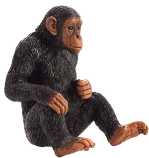 Chimpanzee Figurine Sitting Pose PNG Image