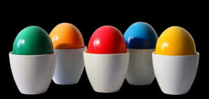 Colorful Eggsin Cupson Black Background PNG image with transparent background