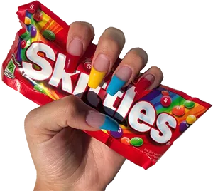 Colorful Nails Holding Skittles Package PNG Image