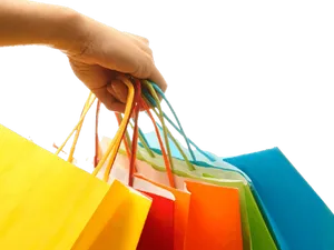 Colorful Shopping Bagsin Hand PNG Image