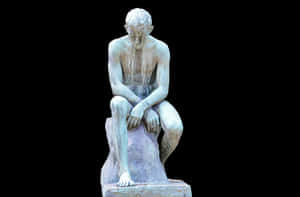 Contemplative Figure Statue PNG image with transparent background