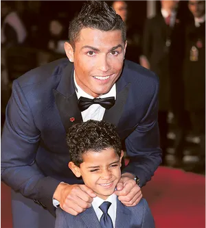 Cristiano Ronaldo Smiling With Child At Event PNG Image