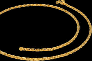 Elegant Gold Chainon Black Background PNG image with transparent background