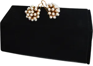 Elegant Pearl Earrings Display PNG Image