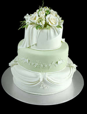 Elegant Three Tier Wedding Cakewith Floral Topper PNG image with transparent background
