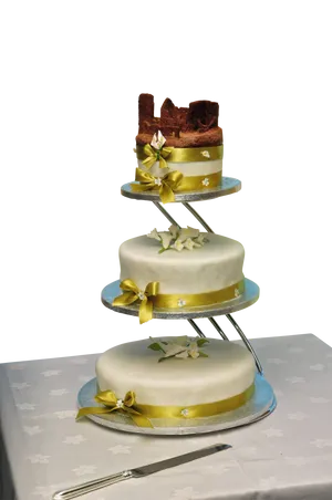 Elegant Three Tier Wedding Cakewith Gold Ribbons PNG Image