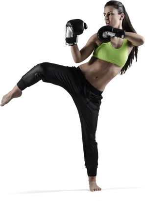 Female Kickboxer Performing High Kick PNG Image