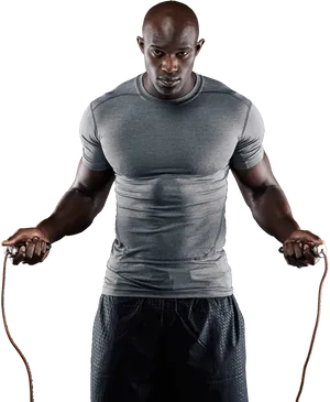 Focused Fitness Enthusiastwith Jump Rope PNG Image