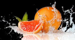 Fresh Grapefruit Splash Water Droplets PNG with transparent background