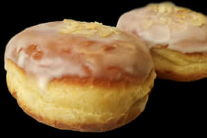 Glazed Almond Donuts Black Background PNG image with transparent background