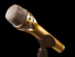 Golden Microphoneon Black Background PNG image with transparent background