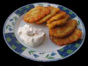 Golden Potato Pancakeswith Sour Cream PNG with transparent background