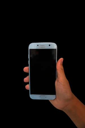 Hand Holding Smartphone Black Background PNG image with transparent background