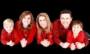 Happy Familyin Red Outfits PNG image with transparent background