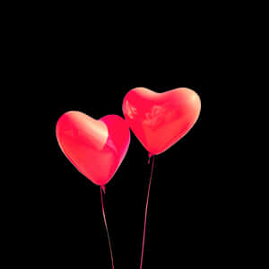 Heart Shaped Balloonson Black Background PNG image with transparent background