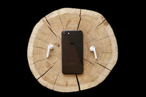 i Phoneand Air Podson Wooden Background PNG image with transparent background
