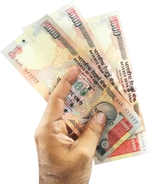 Indian Currency Notesin Hand PNG Image