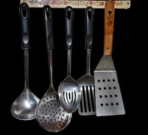 Kitchen Utensils Hangingon Rack PNG with transparent background