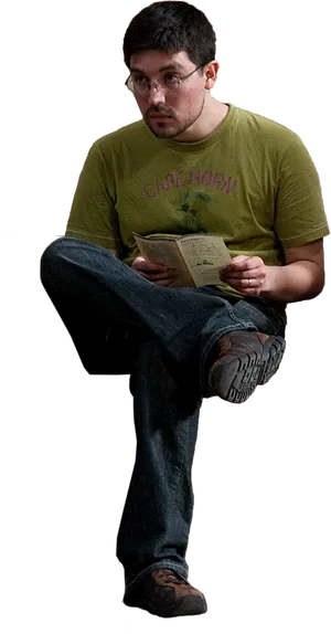 Man Reading Book While Sitting Cross Legged PNG Image