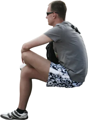 Man Sitting Casually Outdoors PNG Image