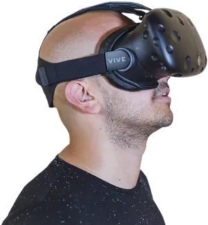 Man Wearing H T C Vive V R Headset PNG Image