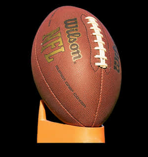 Official N F L Footballon Display Stand PNG image with transparent background