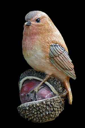 Perched Bird Sculptureon Acorn PNG image with transparent background