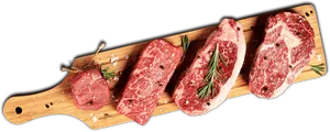 Raw Steak Selectionon Wooden Board PNG Image