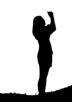 Silhouetteof Woman Raising Hand PNG image with transparent background
