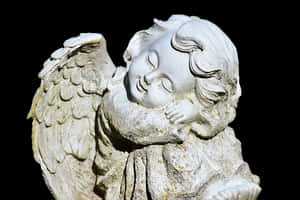 Sleeping Cherub Statue PNG image with transparent background