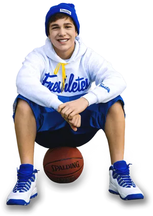 Smiling Teen Basketball Player Sitting PNG Image