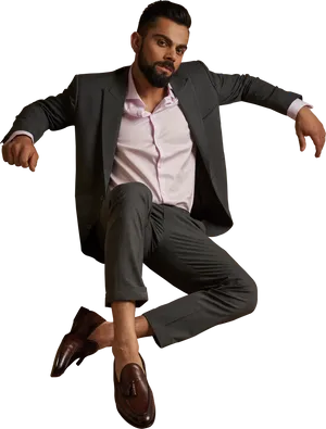 Stylish Manin Suit Seated Pose PNG Image