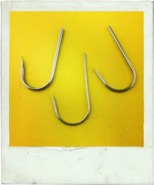 Three Fish Hooks Yellow Background PNG Image