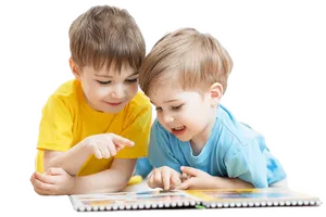 Two Boys Reading Book Together PNG Image