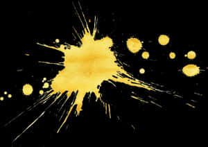 Vibrant Yellow Paint Splatteron Black PNG image with transparent background