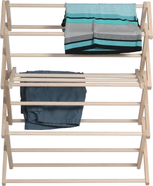 Wooden Clothes Drying Rack With Towels And Pants PNG Image