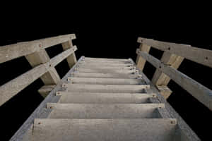 Wooden Ladder Against Black Background.jpg PNG image with transparent background