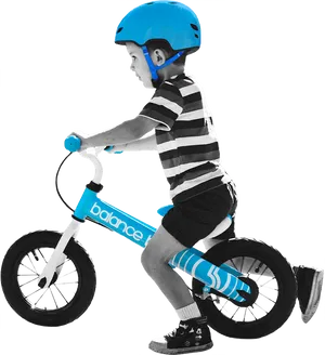 Young Boy Riding Balance Bike PNG Image