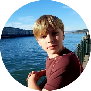 Young Boy Waterfront Vacation PNG Image