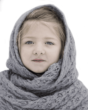 Young Girl Wrappedin Knit Scarf PNG image with transparent background